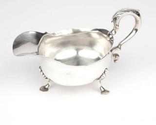 Appraisal: A George IV sterling silver gravy boat London with maker's