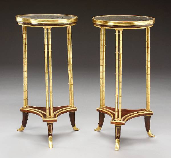 Appraisal: A pair of Neoclassical style gilt bronze and mahogany gueridons