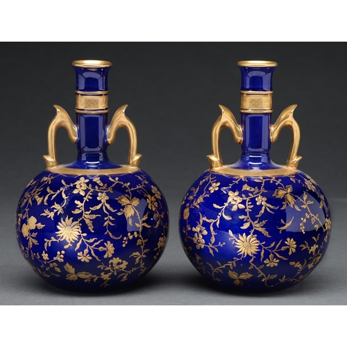 Appraisal: A pair of Mintons cobalt ground bone china drumstick vases