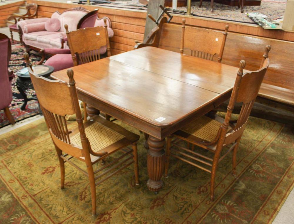 Appraisal: SQUARE OAK DINING TABLE FOUR CHAIRS AND A LEAF American