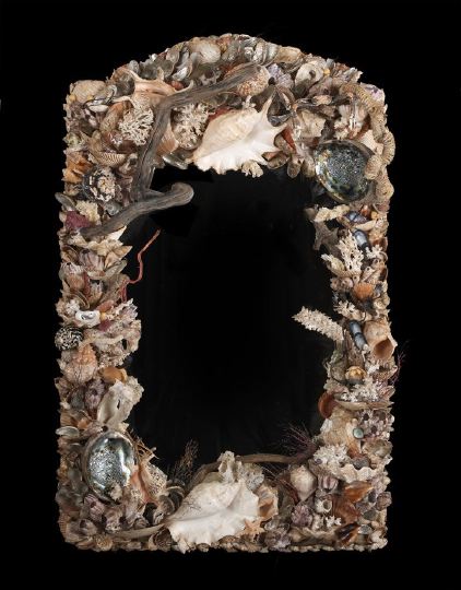 Appraisal: Exuberantly Modeled Grotto-Style Looking Glass the rectangular mirror plate surrounded