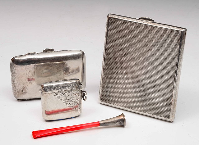 Appraisal: Two silver cigarette casesand a silver vesta box grams together