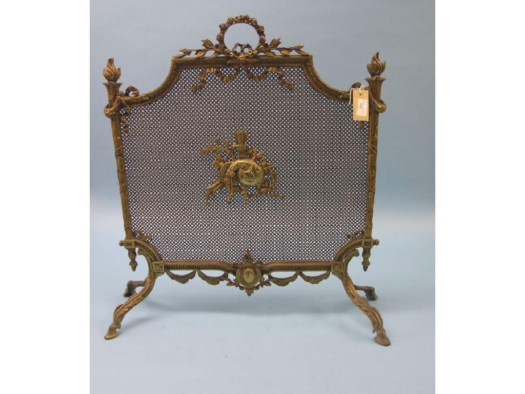 Appraisal: An early th century cast gilt-brass fireguard in Louis XVI-style