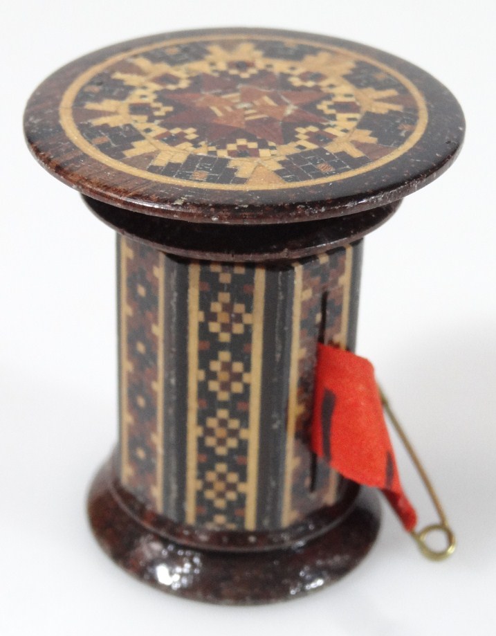 Appraisal: A late thC Tunbridge ware tape measure of cylindrical outline