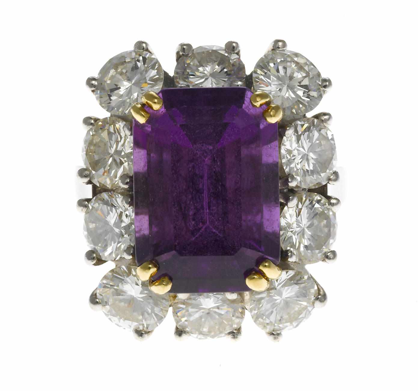 Appraisal: An amethyst and diamond ring cut-corner rectangular step-cut amethyst measuring