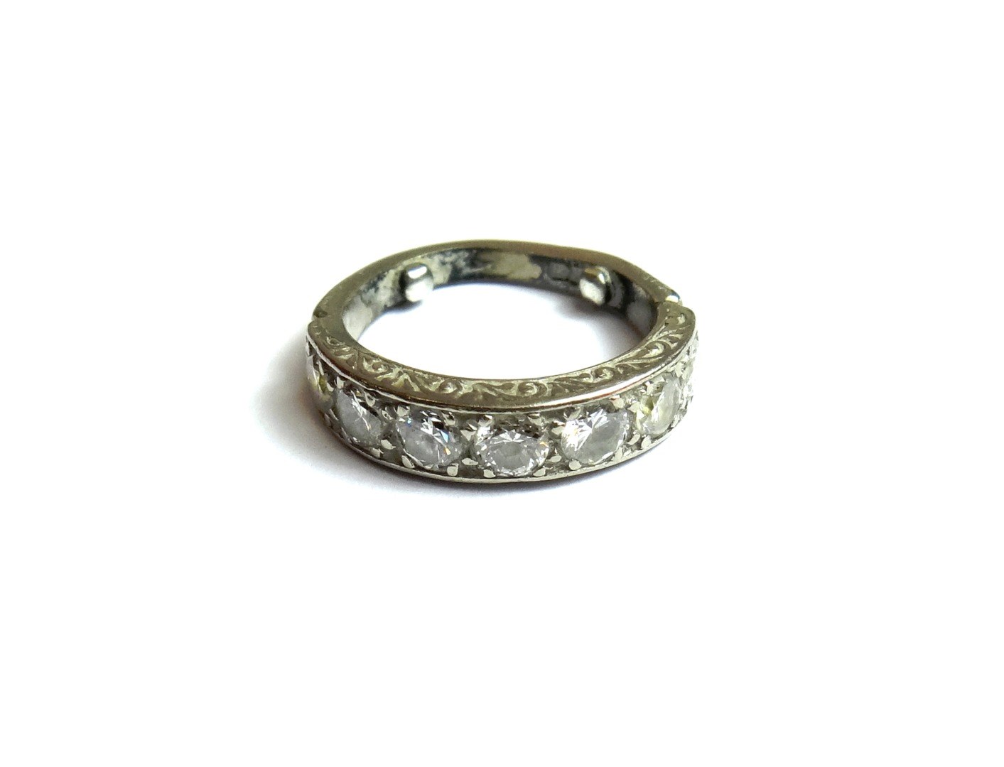 Appraisal: A diamond set seven stone half eternity ring mounted with