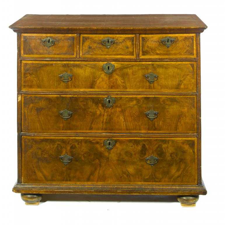 Appraisal: A GEORGE I WALNUT AND FEATHERBANDED CHEST OF DRAWERS the