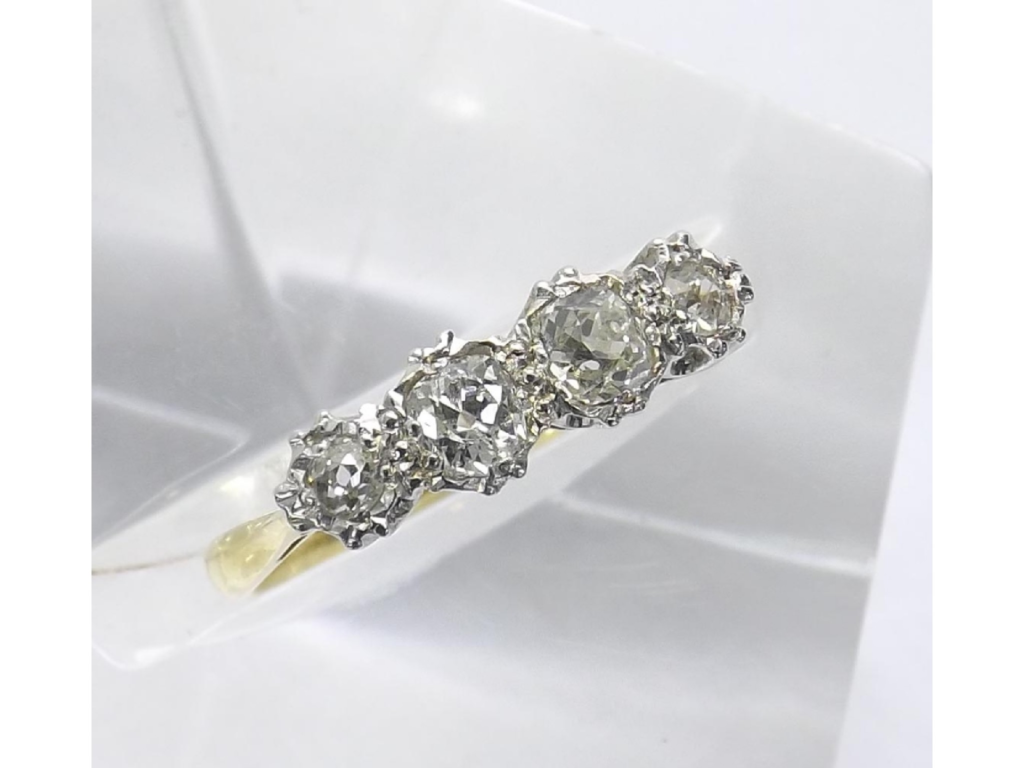 Appraisal: - -b ct and platinum four stone old brilliant-cut diamond