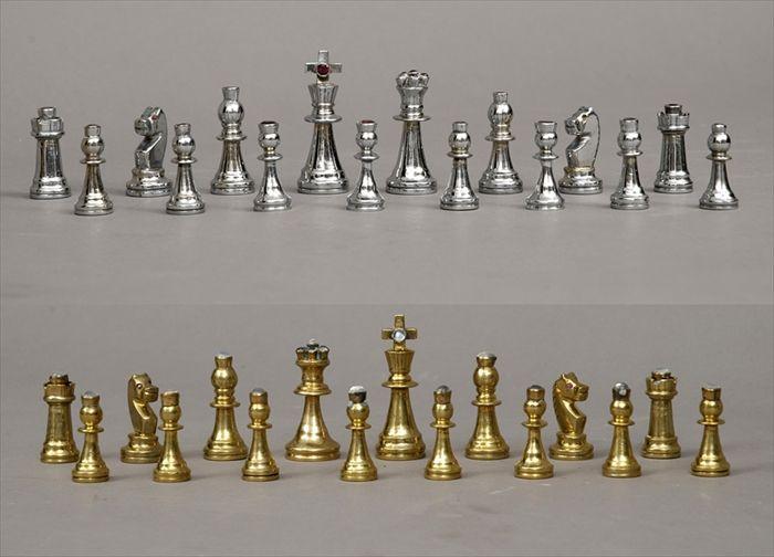 Appraisal: Five Medieval-Style Brass and Nickel-Plated Chess Sets King in queen