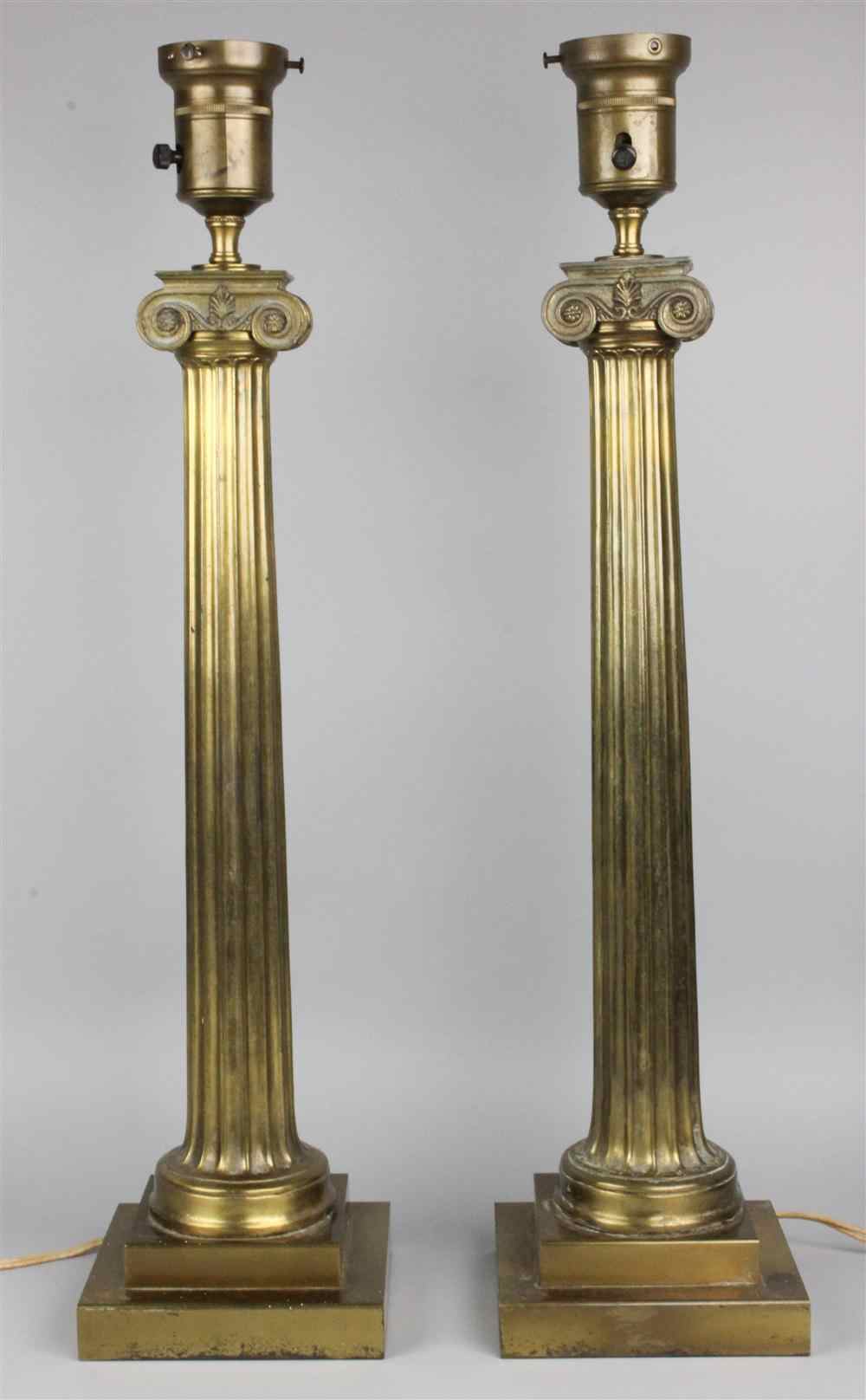 Appraisal: PAIR OF BRASS COLUMNAR TABLE LAMPS with scroll capital and