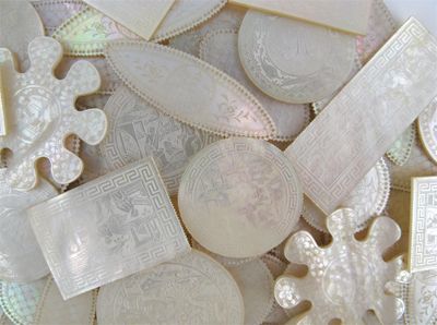 Appraisal: A collection of mother of pearl game counters variously decorated