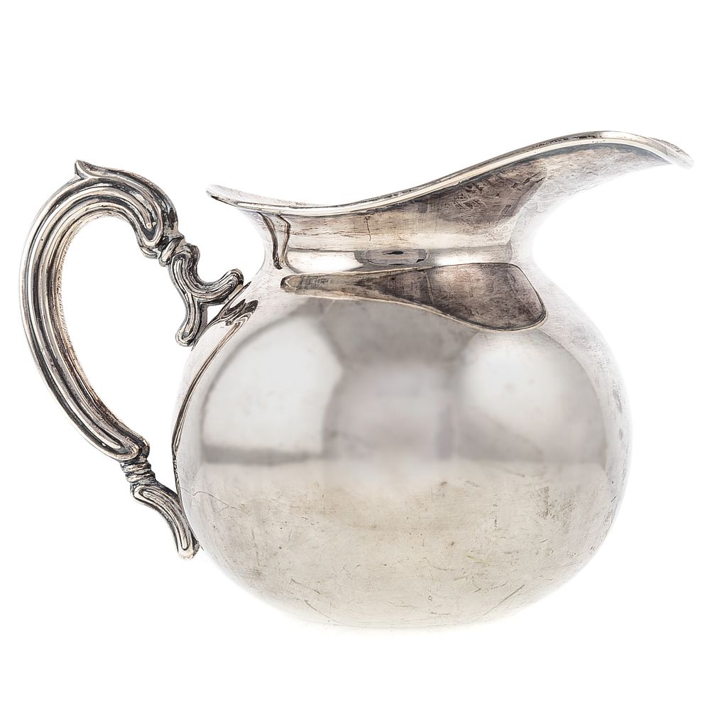 Appraisal: Peruvian Sterling Silver Pitcher squat bulbous form with foliate-capped handle