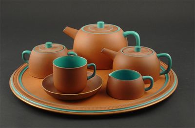 Appraisal: A Watcombe Torquay terracotta extended tea set the design attributed