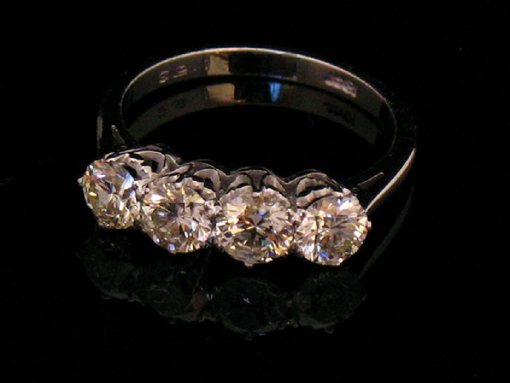 Appraisal: A FOUR STONE DIAMOND DRESS RING the four round brilliant-cut