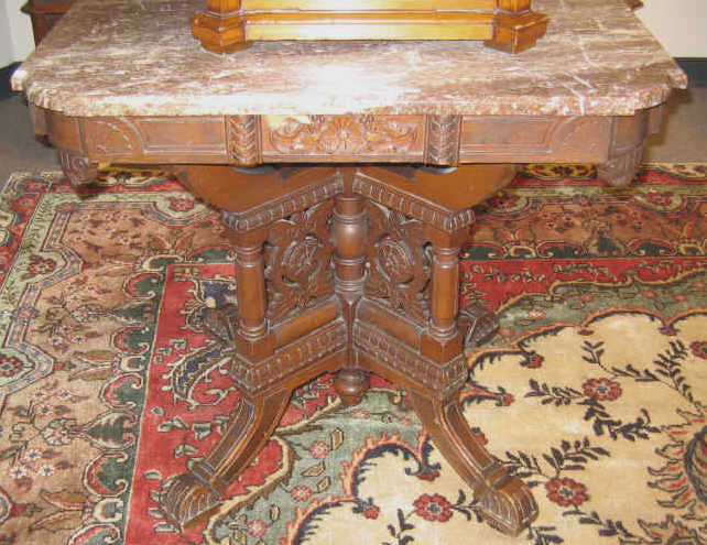 Appraisal: AMERICAN RENAISSANCE REVIVAL WALNUT CENTER TABLE The shaped marble top