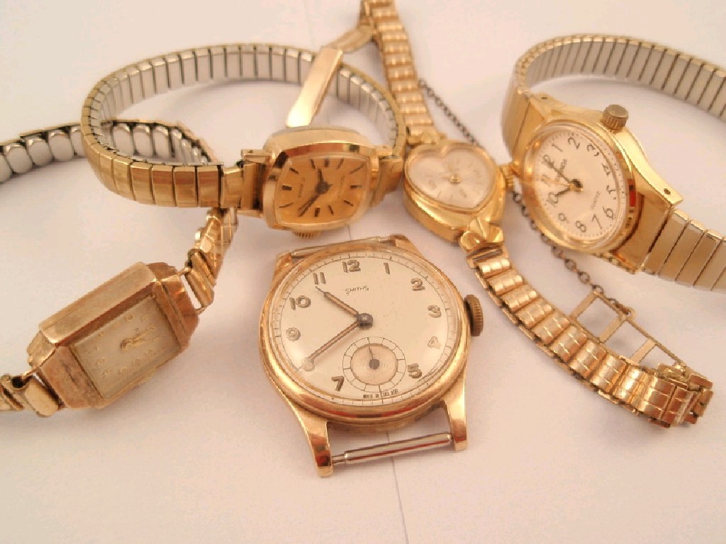 Appraisal: A gentleman's engraved ct presentation watch head and four ladies