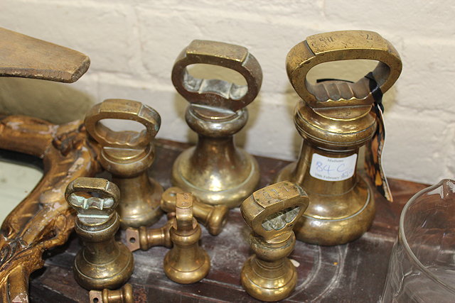 Appraisal: A GRADUATED HARLEQUIN SET OF VICTORIAN AND LATER BRASS BELL