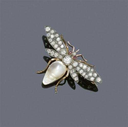 Appraisal: PEARL AND DIAMOND BROOCH ca Silver over yellow gold Very