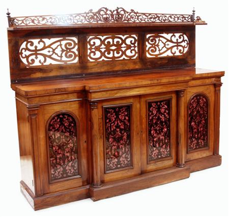 Appraisal: A Victorian rosewood breakfront chiffonier the pierced fretwork gallery and