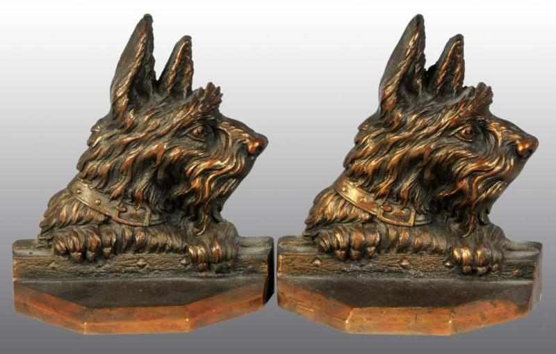 Appraisal: Cast Iron Scottie Head Bookends Description Copper electroplated over cast