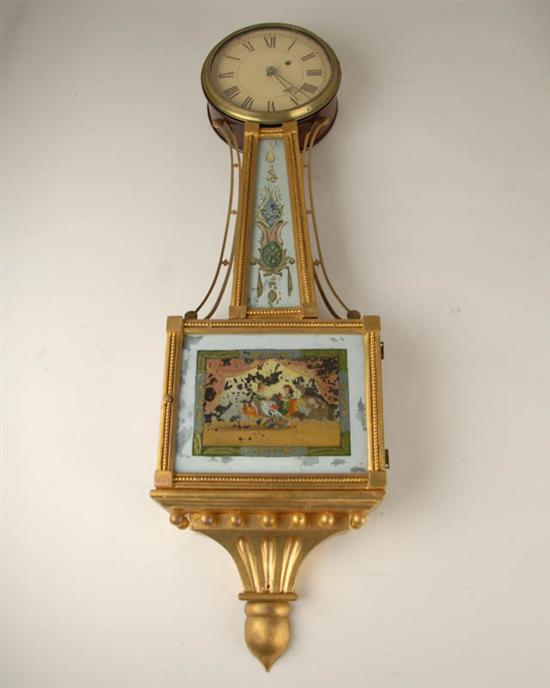 Appraisal: An E-M th C New England Banjo Clock in a