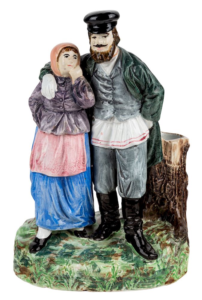 Appraisal: A RUSSIAN PORCELAIN FIGURAL GROUP OF A PEASANT COUPLE KUZNETSOV