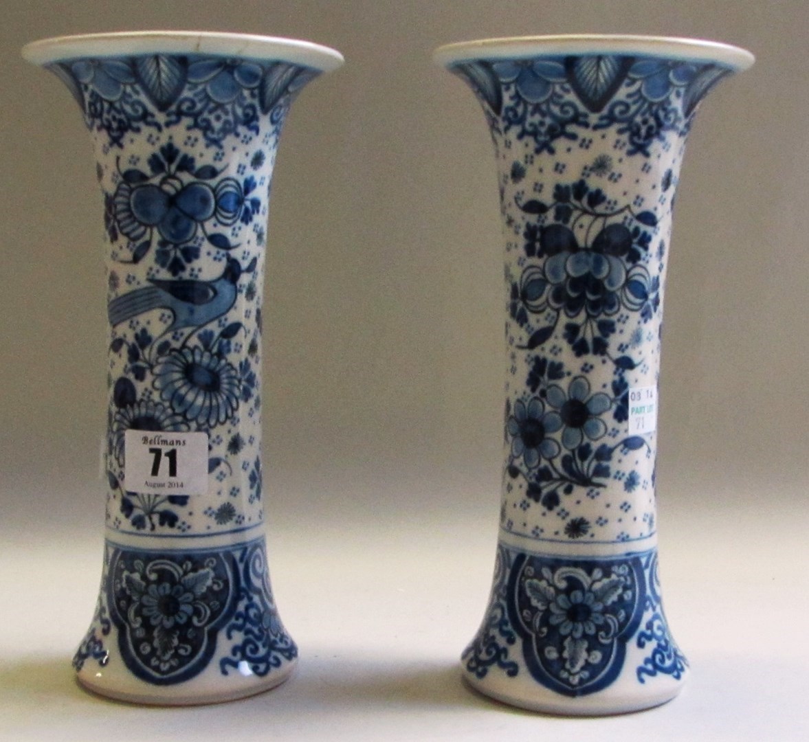 Appraisal: A pair of Dutch Delft blue and white sleeve vases