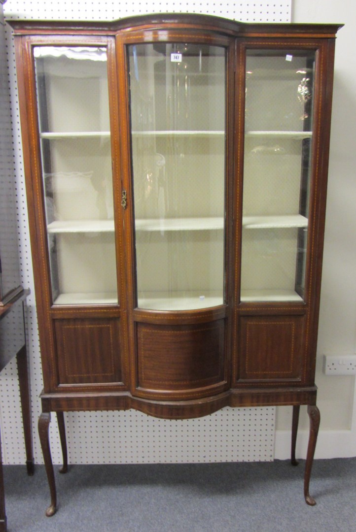 Appraisal: An Edwardian inlaid mahogany bowfront display cabinet on later slender