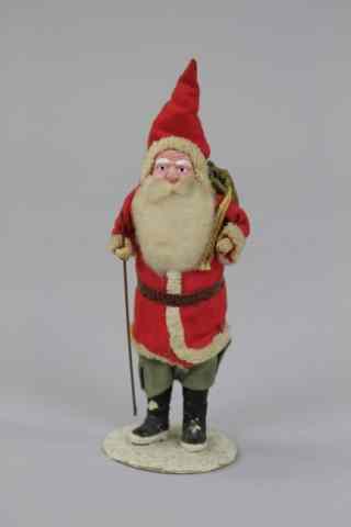 Appraisal: TALL SANTA WITH WALKING STICK Composition and cloth Santa with