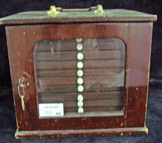 Appraisal: A coin cabinet with brass carrying handle to the top