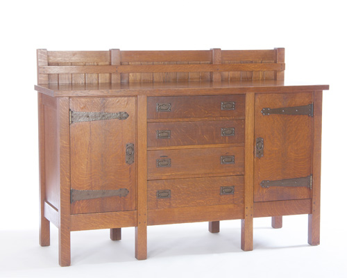 Appraisal: GUSTAV STICKLEY Eight-leg sideboard with four central drawers flanked by