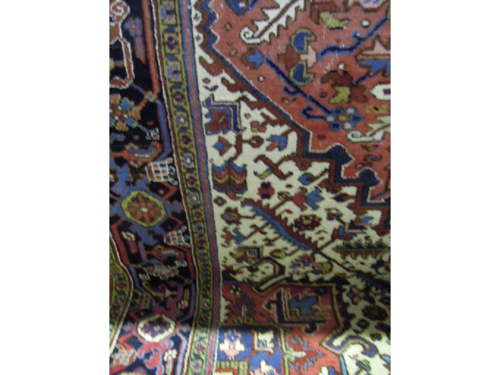 Appraisal: A large Heriz rug with a central geometric medallion and