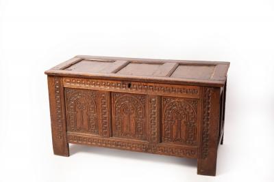 Appraisal: A th Century oak chest the triple-panel hinged cover above