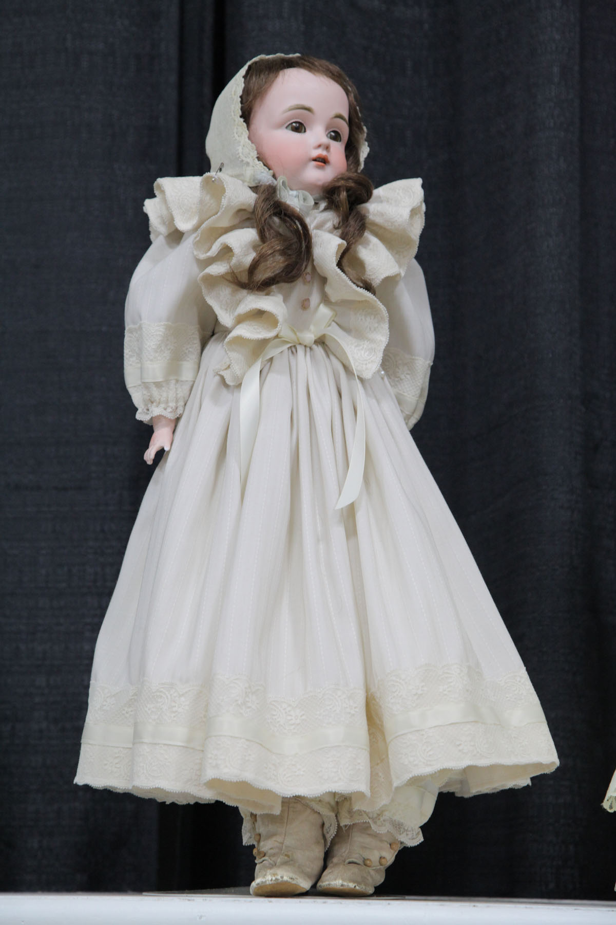 Appraisal: DOLL German th century Bisque head and hands brown sleepy