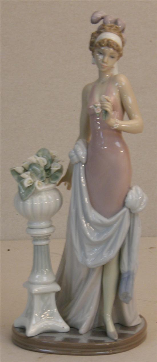 Appraisal: Lladro figure of a flapper standing next to a jardiniere