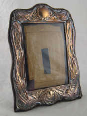 Appraisal: A silver photo frame in the Art Nouveau manner x