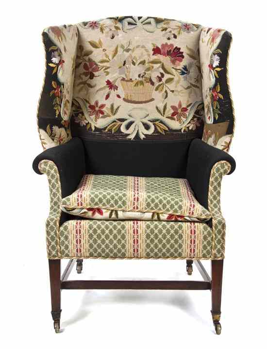 Appraisal: An American Mahogany Wingback Armchair having upholstered back arms and