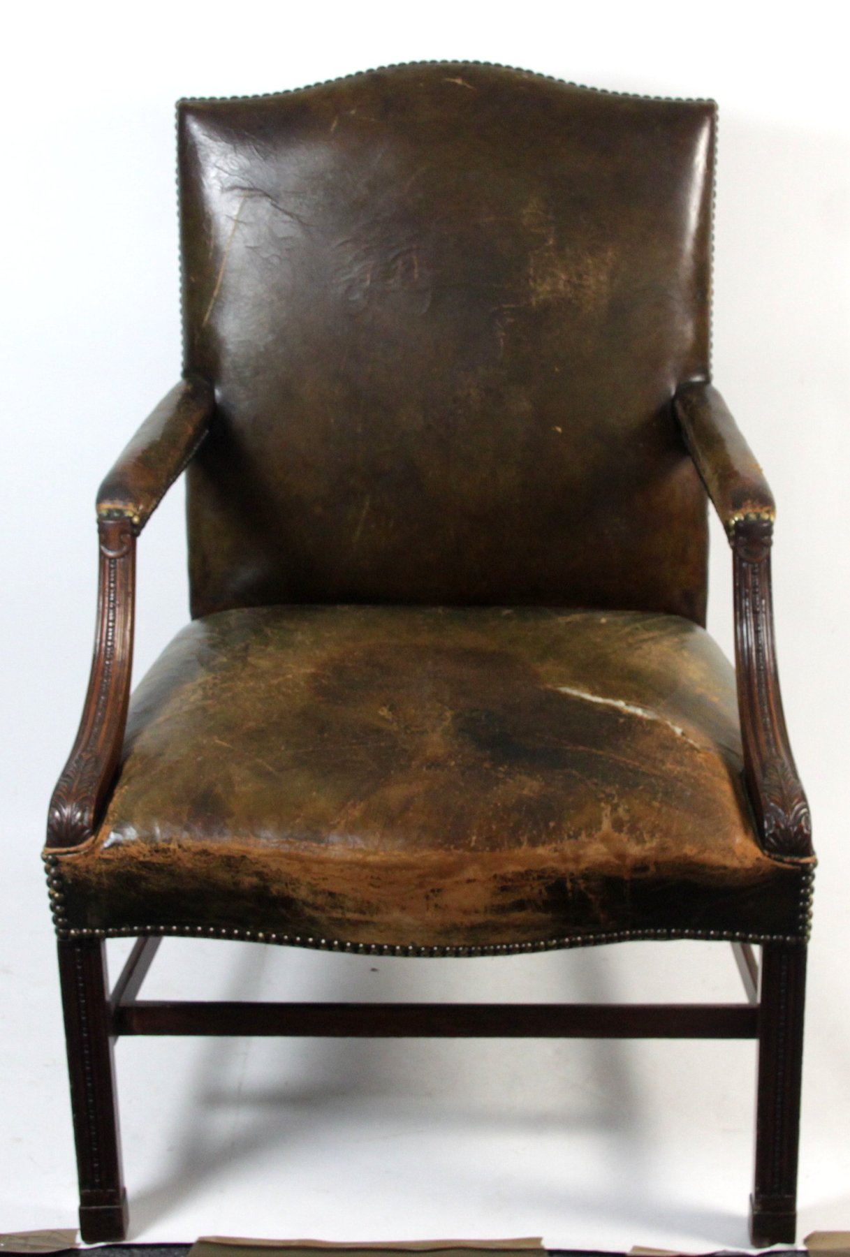 Appraisal: An th Century Gainsborough armchair the leather upholstered back seat