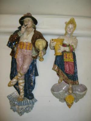 Appraisal: TWO GINORI MAIOLICA FIGURAL WALL POCKETS modelled as a lady