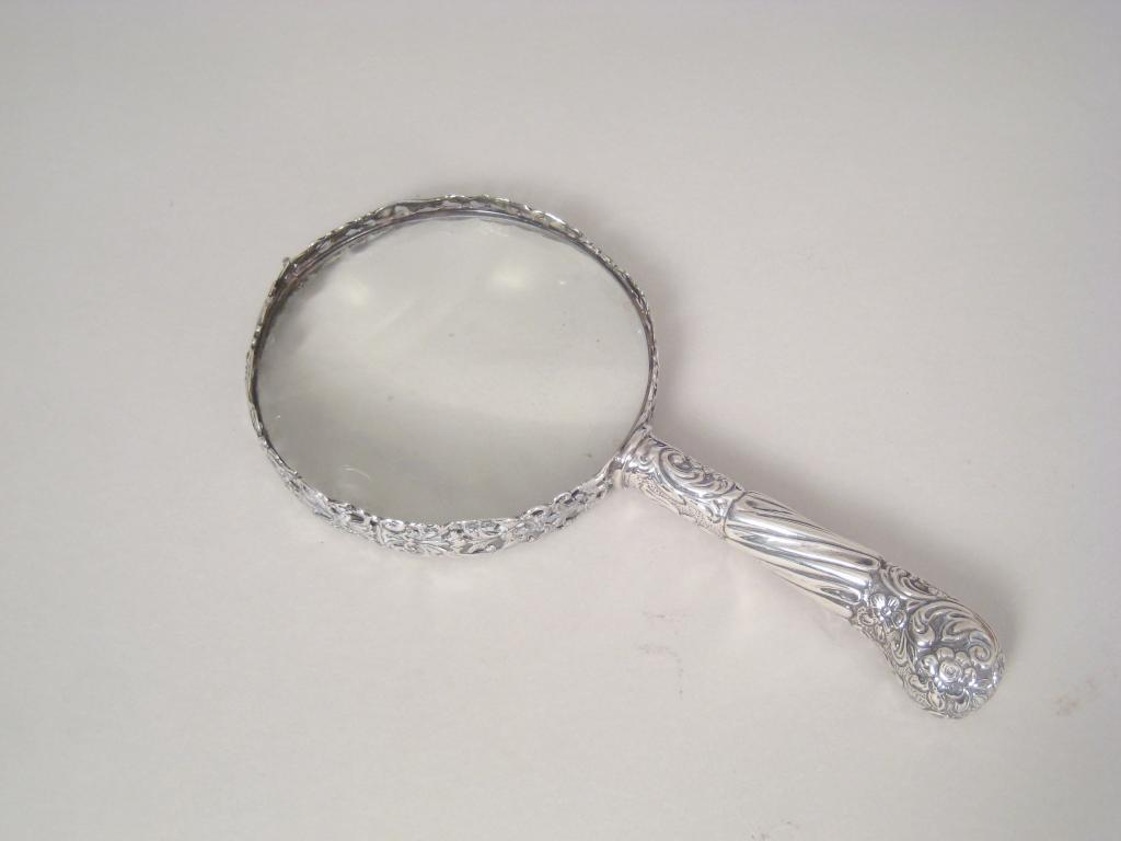 Appraisal: A Victorian silver handle Magnifying Glass with floral embossed pistol