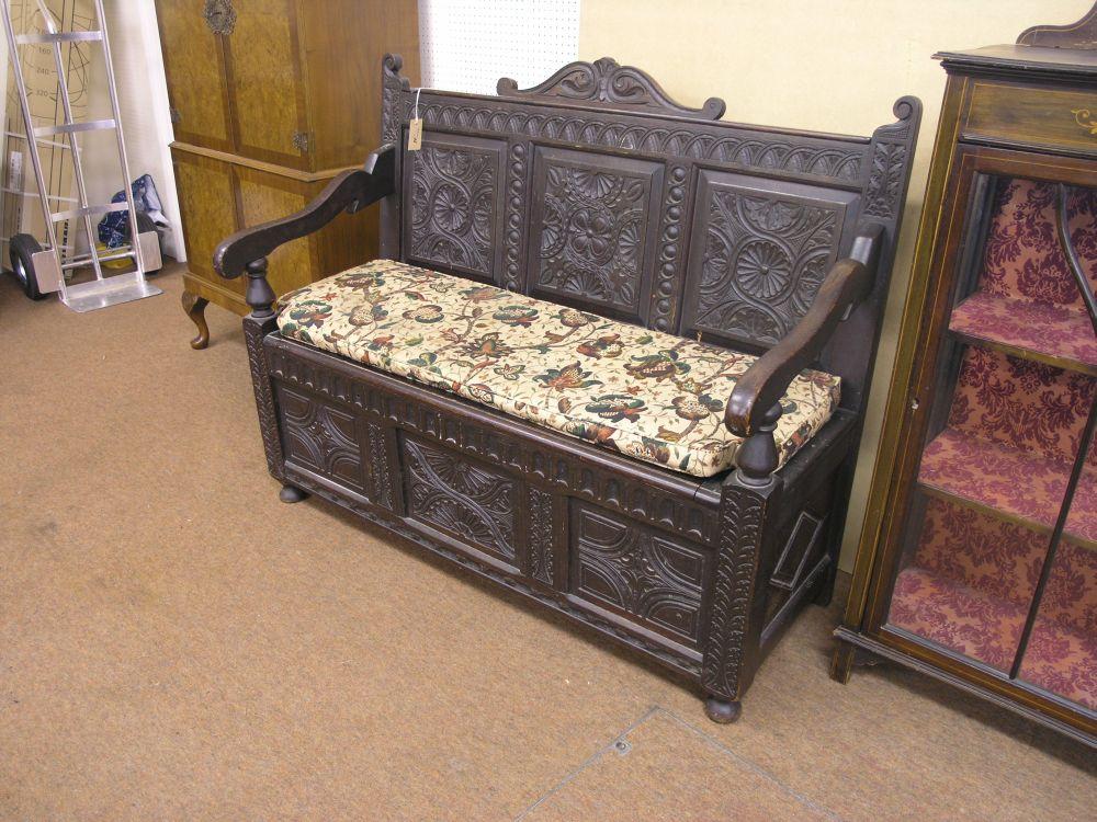 Appraisal: A Victorian dark carved monk's bench with carved cresting carved