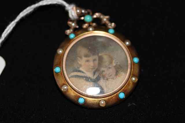 Appraisal: A VICTORIAN SILVER LOCKET set with turquoise and pearl pearl