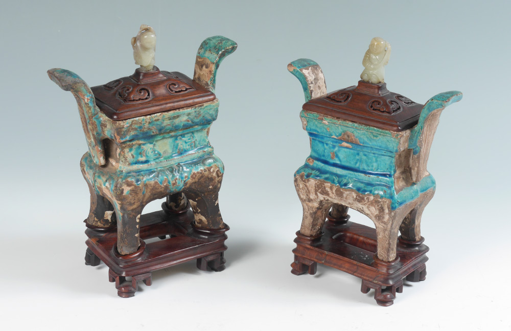 Appraisal: PAIR CHINESE JADE FINIAL ARCHAIC FORM EARTHENWARE CENSERS Mottled blue