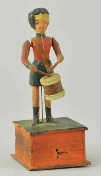 Appraisal: NURNBERG DRUMMING BOY ON BASE Germany hand crank at front