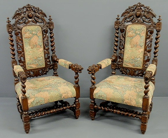 Appraisal: Pair of oak Elizabethan style open armchairs with carved exotic