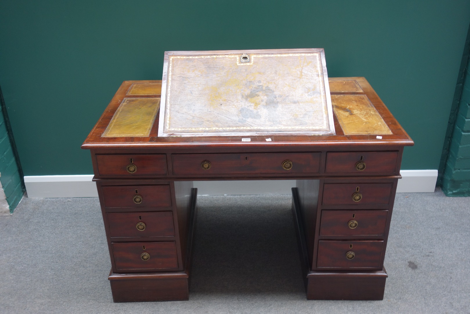 Appraisal: A th century mahogany pedestal desk the top with angle