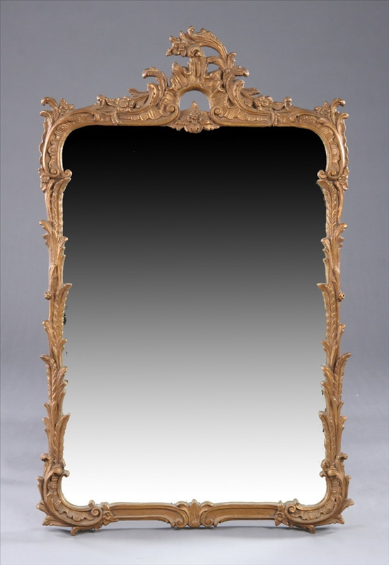 Appraisal: ROCOCO STYLE COMPOSITION AND BRONZE-PAINTED MIRROR th century Pierced scrolling