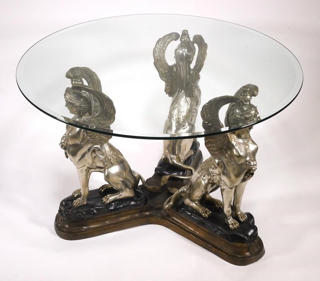 Appraisal: Three figural female silvered brass gryphons hold aloft the round