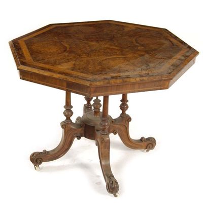 Appraisal: A Victorian walnut centre table the octagonal burr veneered top