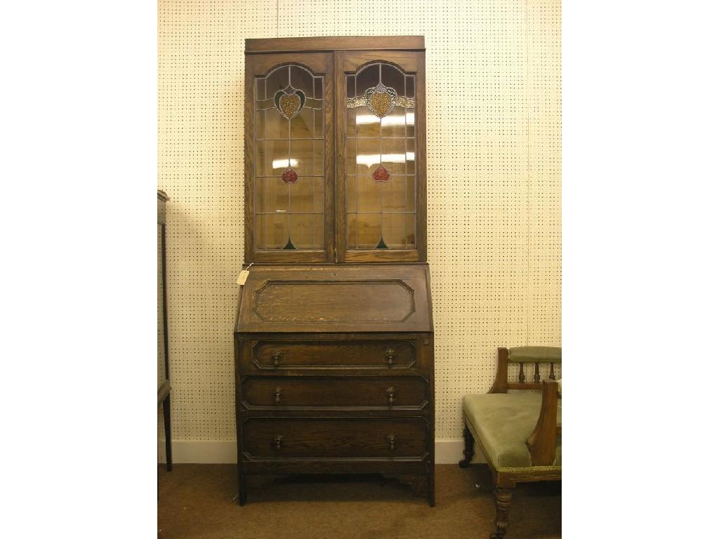 Appraisal: A 's solid dark oak bureau bookcase upper stage enclosed